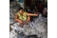 Image An Asian woman sitting in plastic.